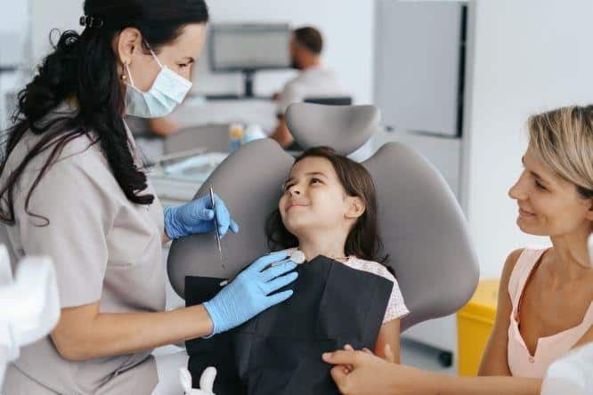 child sitting in the dental chair