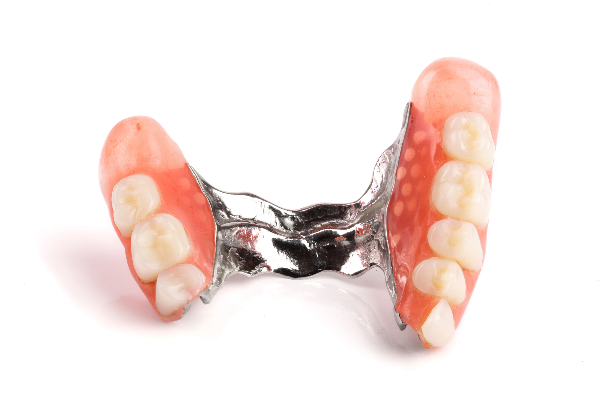 photo of a partial denture on a white background